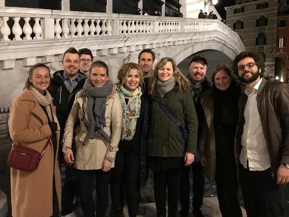 Lucia (front row, right) and the Laundry and Home Care team went to a pizza restaurant in Venice 